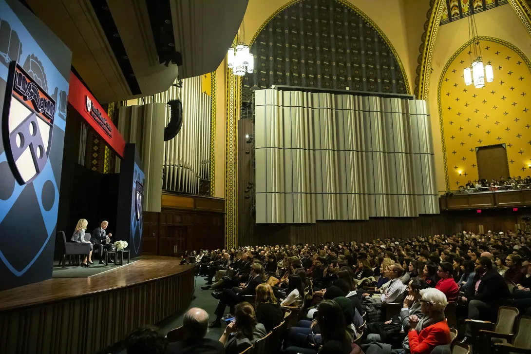 Irvine Auditorium at the University of Pennsylvania hosting a large event on stage with a full audience